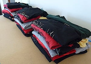 3 stack of identical T-shirts. 