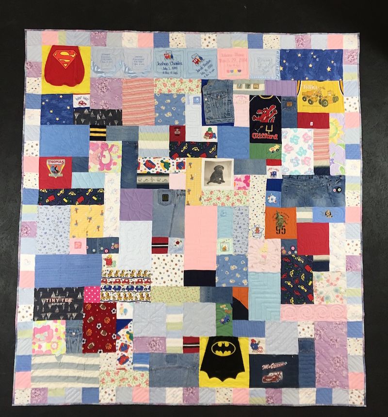 Baby clothes quilt with border made by Too Cool T-shirt Quilts