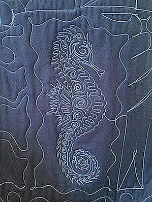 The quilting on the back of a T-shirt quilt.  this is the same seahorse that is on the front of the quilt.