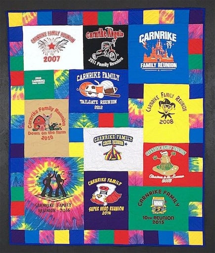 T-shirt quilt with a tie-dye and solid color pieced border. 