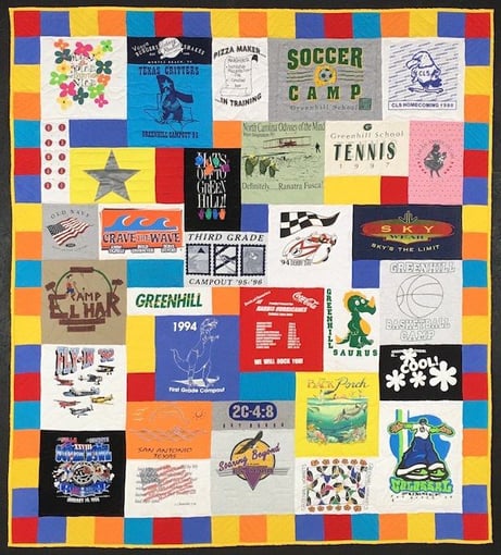 colorful fun summer feel to this T-shirt quilt. the pieced binding made from left over fabric from the T-shirts used in the quilt. 