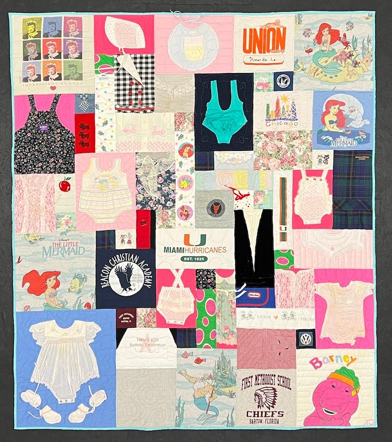 Complex baby clothes quilt by Too Cool T-shirt Quilts