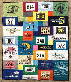 A runners T-shirt quilt that includes both T-shirts and race bibs.