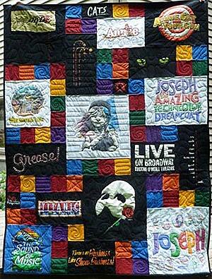 Theater T-shirt quilts was made larger with blank blocks. 