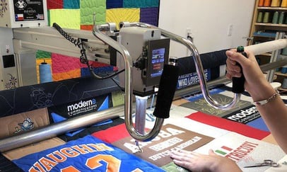 long-arm quilting should be done in house for a T-shirt quilt maker