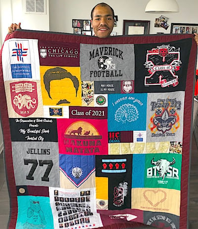 Man holding quilt with 2 border