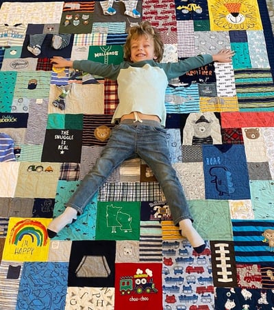 super cut boy on baby clothes quilt by Too Cool T-shirt Quilts