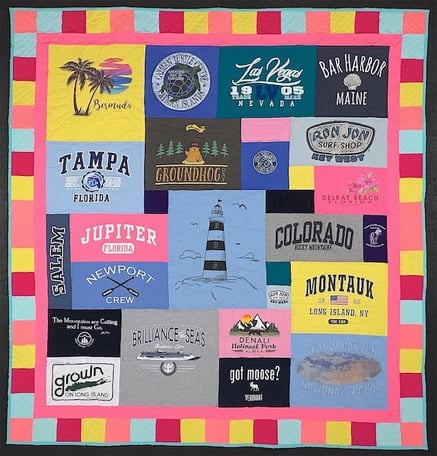 Travel T-shirt quilt  with a cheerful pieced and solid border. 