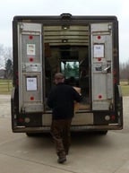 UPS Guy picking up our quilts