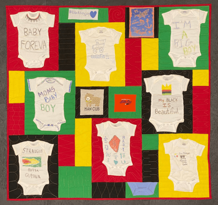 Baby Onesies turned into a quilt. Onesies were created at a baby shower and then transformed into  quilt when the lucky baby turned 1.